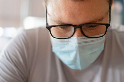 Close-up of young man wearing mask