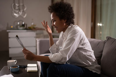 Ethnic businesswoman during online meeting at home