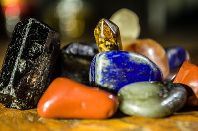 Close-up of colorful gemstones on table