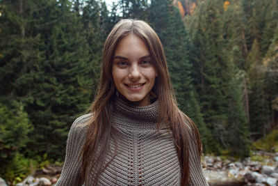 Portrait of a girl in the background of the autumn forest