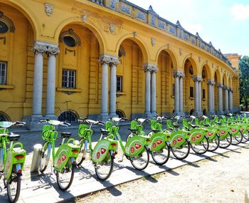 Bicycles parked on street against buildings