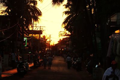 People on street in city at sunset