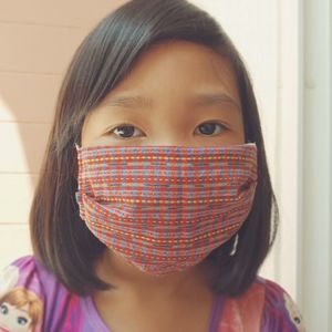 Close-up portrait of girl at home