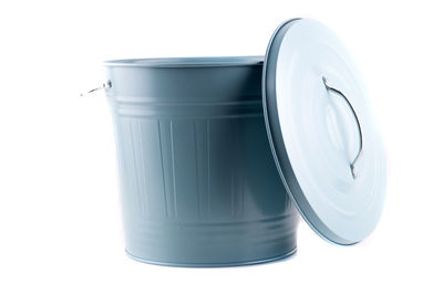 Close-up of bucket and lid against white background