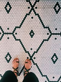 Low section of woman standing on floor