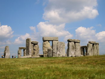 Old ruins on field against sky