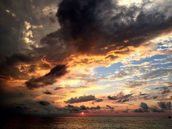 Scenic view of sea against dramatic sky