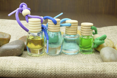 Close-up of multi colored medicine bottles on table