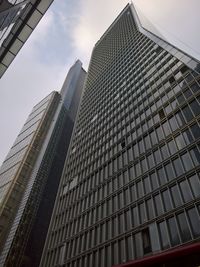 Low angle view of modern buildings against sky in city