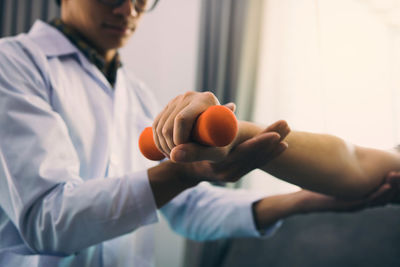 Doctor helping patient at clinic