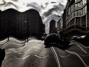 View of buildings against cloudy sky