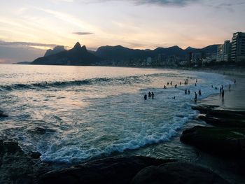 Scenic view of beach against sky during sunset