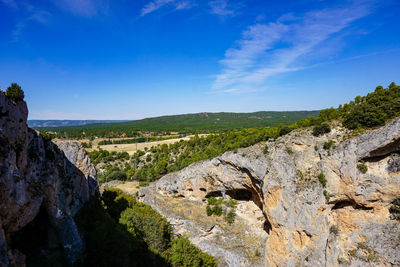 Scenic view of landscape against blue sky