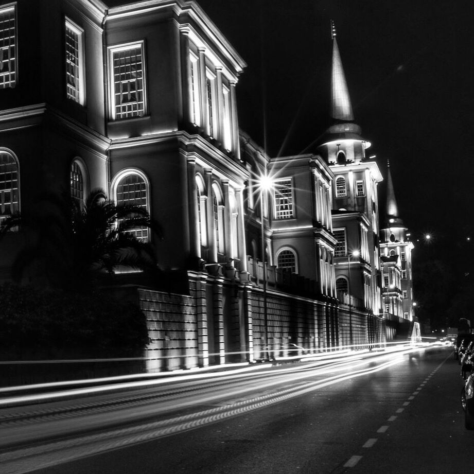 architecture, building exterior, built structure, night, illuminated, street, church, religion, the way forward, place of worship, arch, spirituality, road, facade, city, incidental people, cathedral, travel destinations