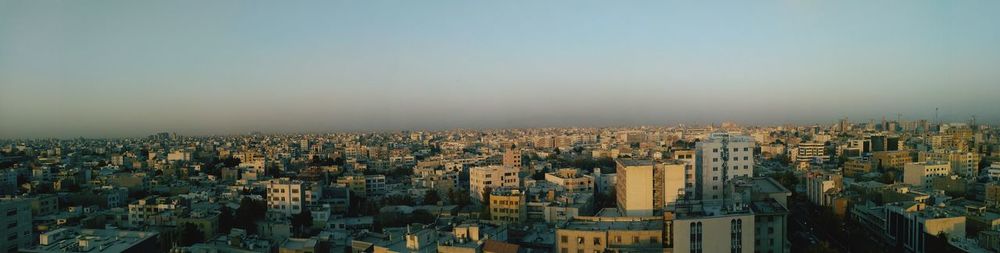 Panoramic view of cityscape against clear sky