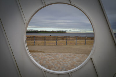 Scenic view of sea seen through window