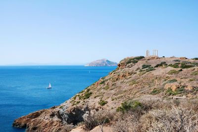 Scenic view of sea against clear blue sky