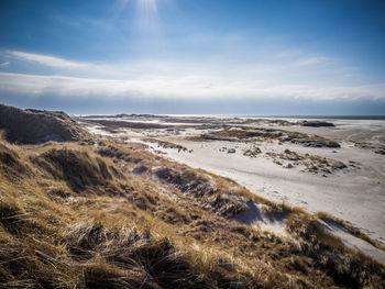 Scenic view of beach against sky