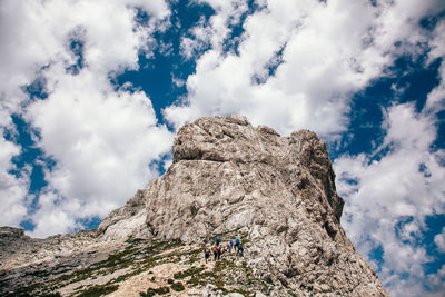 Low angle view of rocky mountain against sky