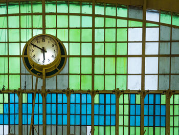 Low angle view of clock on wall