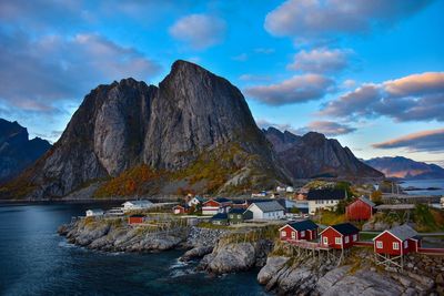 Scenic view of sea and mountains against sky