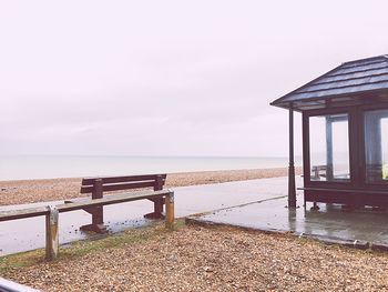 Lifeguard hut on beach against sky