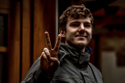 Portrait of young man holding camera