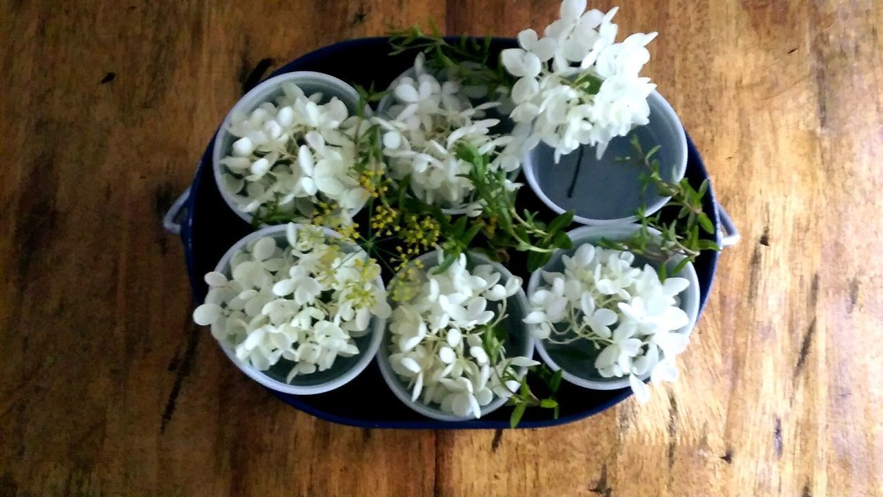 HIGH ANGLE VIEW OF BOUQUET ON WHITE TABLE