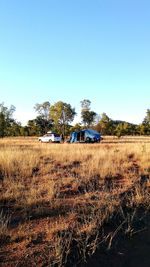 Scenic view of field against clear blue sky