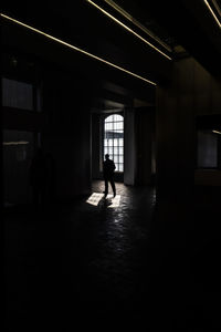 Silhouette man standing in building