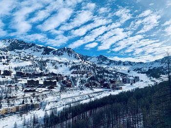 Scenic view of snowcapped mountains against sky