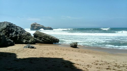 Scenic view of beach against clear sky