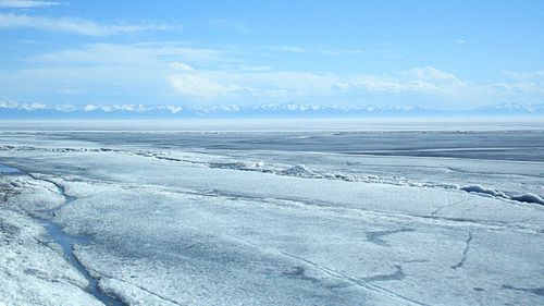 Scenic view of frozen landscape against sky