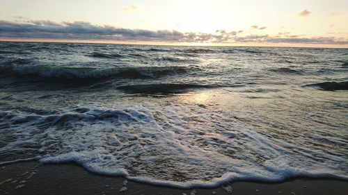 Scenic view of sea at sunset