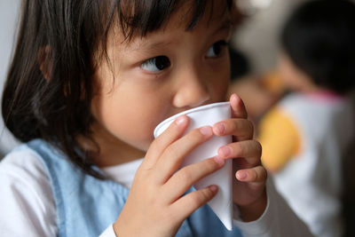 Close-up of girl drinking coffee