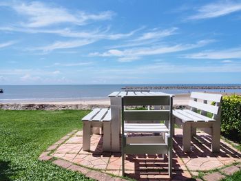 Lifeguard hut on beach against sky