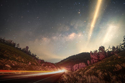 Scenic view of landscape against sky at night