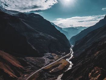 Aerial view of mountain range against sky