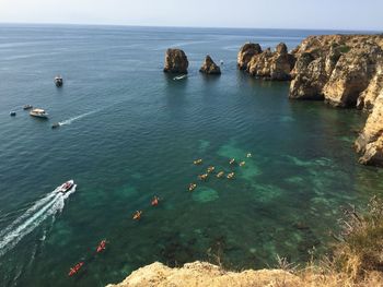 High angle view of canoeing in calm blue sea