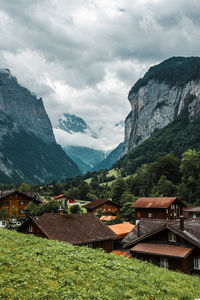 Lauterbrunnen valley, switzerland. swiss alps. village in mountains. forest, rocks, clouds, meadows