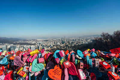 Colorful padlocks against blue sky