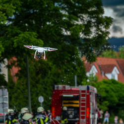 Toy flying by trees