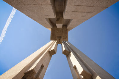 Low angle view of bridge against clear blue sky