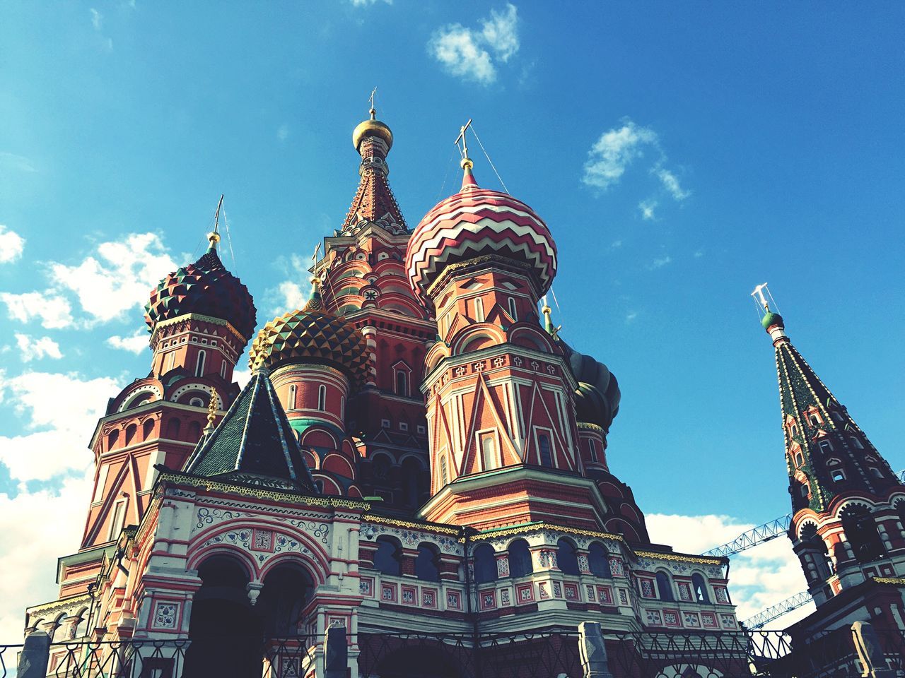 architecture, low angle view, built structure, building exterior, sky, famous place, religion, place of worship, travel destinations, blue, spirituality, tourism, cathedral, travel, international landmark, cloud - sky, capital cities, church, city