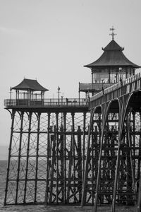 Built structure in sea against clear sky