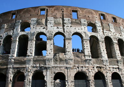 Low angle view of historical colosseum against clear sky