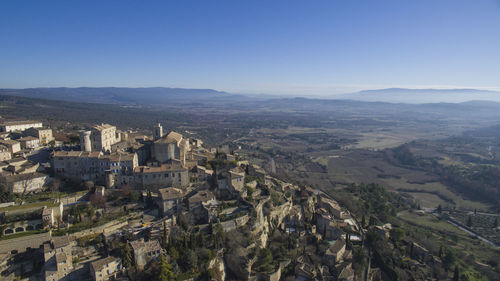 High angle view of buildings in city against clear sky