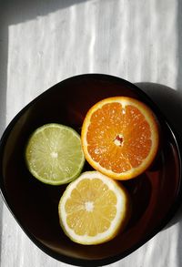 High angle view of fruits in plate on table