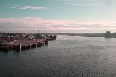 View of marina in city at sunset