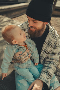 Dad with son smiling each other